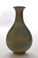 Vase aus den 
1950er Jahren. 
Glasur in 
Gelb-, Braun- 
und Himmelblau 
Tonen. 
Vase auf ...