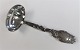 Silberner 
Soßenlöffel mit 
Stahl. 
Produziert 
1951. Länge 
18,5 cm