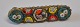 Mikromosaikbrosche, 
Italien des 19. 
Jahrhunderts. 
Montage aus 
Messing. H.: 
1cm. L.: 4cm.
Guter ...