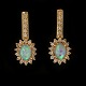 Pair of 14kt gold earrings each with an oval opal and 19 diamonds of ca. 
0,015ct. H: 24mm. W: 10mm