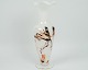 A milky white 
vase with the 
composition of 
golden colors 
from around the 
1970s.
Dimensions in 
...