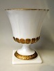 American vase 
of pressed 
white opal 
glass, 20th 
century with 
gold bronzes. 
Stamped: E.O 
Brody. J ...