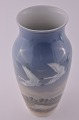 Royal 
Copenhagen 
Porzellan Vase 
dekoriert mit 
Schwänen nr, 
1955-137. Höhe 
31,5 cm. 
Tadelloser ...