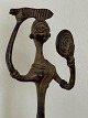Large Asian 
bronze figure 
in the form of 
a woman combing 
her hair while 
looking in the 
mirror. ...