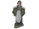 Royal 
Copenhagen 
figurine, girl 
with hake in 
green colours.
The factory 
hallmark shows 
that ...