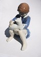 Charming 
porcelain 
figure of 
seated young 
girl with cat 
in lap. 
Designed by 
John Calster 
for ...