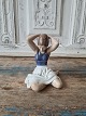 Royal 
Copenhagen 
figure - girl 
arranges hair 
No. 4648, 
Factory first
Height 12.5 
cm.
Design: ...