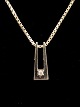 14 carat white 
gold pendant 
0.5 x 1.3 cm. 
with diamond 
and chain 46 
cm. Item No. 
506029