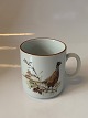 Year mug #1996 
#Jagtstellet 
Mads Stage
"Pheasant"
Height 8 cm 
approx
Nice and well 
maintained ...