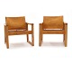 Ein Paar "DIANA" Lounge Stühle mit patiniertem cognacfarbenen LederDesign von Karin Möbring ...