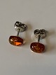 Silver Earrings 
with Amber
Stamped 925
Height 9.97 mm 
approx
The item has 
been checked by 
a ...
