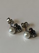 Silver Earrings 
with pearl
Stamped 925
Height 11.94 
mm approx
The item has 
been checked by 
a ...