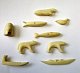 Collection of 
small 
Greenlandic 
bone figures to 
a chain, 20th 
century. A 
total of 9 
pieces. Cuts 
...