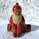 Weihnachtsmann aus Ton auf Baumstumpf mit Leuchter, 13cm breit, 14cm hoch *Mit kleinen Chips und ...