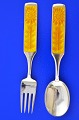 Anton Michelsen 
christmas 
cutlery, gilded 
sterling silver 
with an inlaid 
enamel motif. 
Christmas ...