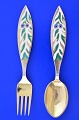 Anton Michelsen 
Christmas 
cutlery,  
gilded sterling 
silver with an 
inlaid enamel 
motif. ...