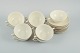 Nine pairs of 
Royal 
Copenhagen 
cream-coloured 
bouillon cups 
with matching 
saucers.
Dated ...