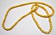 Collier, 19. 
Jh. Aus 
identischen 
Elfenbeinkugeln.
 Mit 120 
Kugeln. Mit 
Schraubverschluss.
 L.: 70 ...