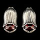 Georg Jensen; 
Heritage 
jewellery 2007. 
Earclips made 
of sterling 
silver set with 
a garnet. 
H. ...