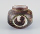 Danish 
ceramicist, 
unique vase 
decorated with 
a baby bird. 
White, green, 
and brown ...