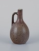 Carl Harry 
Stålhane for 
Rörstrand, 
miniature 
pitcher/vase in 
green-brown 
hues.
Mid-20th ...
