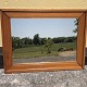 Älterer Spiegel 
im Holzrahmen, 
einige 
Gebrauchsspuren.
 Abmessungen: 
74x57 cm