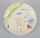 Stig Lindberg 
for 
Gustavsberg. 
"Löja" plate. 
Hand-painted 
with a fish 
motif. 
Satirical ...