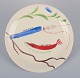 Stig Lindberg 
for 
Gustavsberg. 
"Löja" plate. 
Hand-painted 
with a fish 
motif. 
Satirical ...