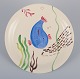 Stig Lindberg 
for 
Gustavsberg. 
"Löja" plate. 
Hand-painted 
with a fish 
motif. 
Satirical ...