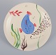 Stig Lindberg 
for 
Gustavsberg. 
"Löja" plate. 
Hand-painted 
with a fish 
motif. 
Satirical ...