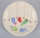 Stig Lindberg 
for 
Gustavsberg. 
"Löja" plate. 
Hand-painted 
with a fish 
motif. 
Satirical ...
