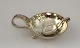 Georg Jensen. 
Sterling (925). 
Salt vessel 
with salt 
spoon. Design 
110. Diameter 5 
cm.