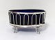 Niels 
Christopher 
Clausen, 
Odense. (NC). 
Silver salt jar 
with blue 
glass. Length 9 
cm. Produced 
...