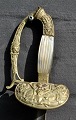 Französische 
Kordel, ca. 
1870. Ohne 
Scheide. L.: 91 
cm. Griff aus 
Perlmutt. Griff 
aus Messing ...
