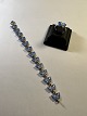 Silbernes 
Schmetterlingsarmband 
zusammen mit 
Ringen aus 
Silber 925, 
blauer Emaille. 
Armband 17 ...