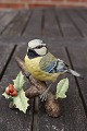 Süße und 
reizende Figur 
aus Biscuit, 
Vogel sitztend 
auf dem Ast der 
Vogelbeere, in 
tadellosem ...