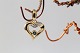 Heart-shaped 
pendant in 14 
carat gold, 
with diamonds 
and ...