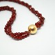 Per Borup; 
Clasp of 14k 
gold with 
necklace of 
carnelian