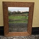 Spiegel im 
Holzrahmen, der 
Rahmen mit 
vielen 
Ausschnitten. 
Abmessungen: 
61x75 cm