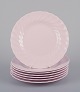 Tuscan, England. Seven plates in light pink porcelain with a wavy edge.Fine English bone ...
