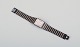 Omega De Ville 
men's 
wristwatch in 
brass and black 
metal.
1980s.
All parts are 
...