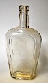 Flaschmann aus 
klarem Glas, 
Dänemark aus 
dem 19. 
Jahrhundert. 
Höhe: 17,5 cm.