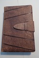 An old little Photo albumMade of hideH: 15cmB: 10,5cmDepth: 3cmIn a good ...