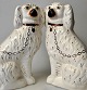 Ein Paar 
Staffordshire-
Hunde, England 
des 19. 
Jahrhunderts. 
Steingut. 
Bemalt und 
vergoldet. H.: 
...