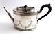 Michelsen. 
Silberne 
Teekanne (830). 
Länge 22,5 cm. 
Höhe 11 cm. 
Produziert 1887