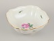 Meissen, 
Germany. Large 
porcelain bowl 
hand-painted 
with a motif of 
a pink rose. 
Gold ...