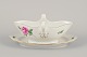Meissen, 
Germany. Sauce 
boat on a stand 
with a motif of 
a pink rose. 
Gold rim.
Approximately 
...