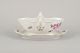 Meissen, 
Germany. Sauce 
boat on a stand 
with a motif of 
a pink rose. 
Gold rim.
Approximately 
...