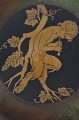Grosse 
Tischplatte von 
Just Andersen 
aus patinierter 
Bronze, 
verziert mit 
einem 
Faun-Motiv. ...