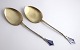 Aug. Thomas. 
Silver-gilt 
serving parts 
with enamel ...
